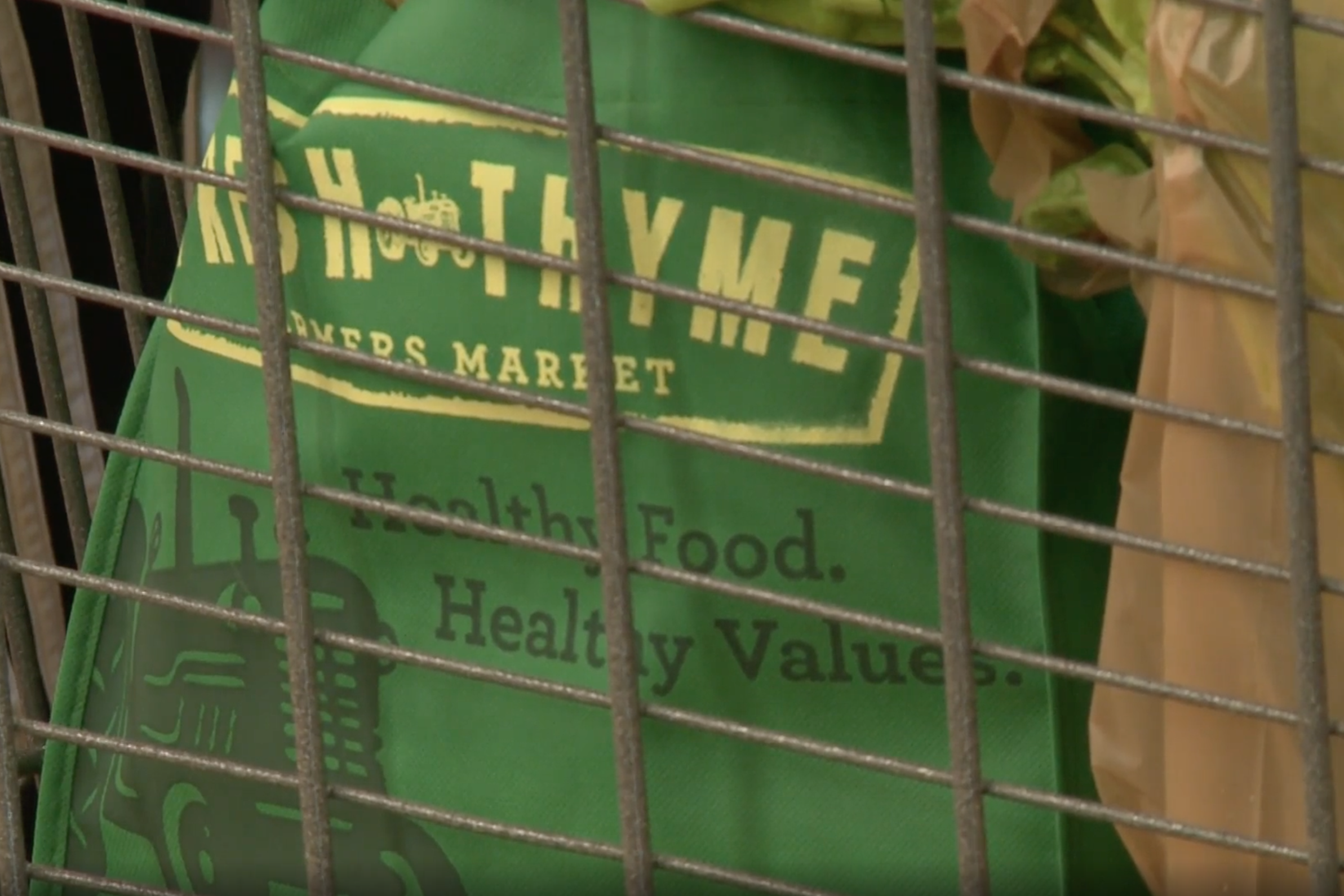 A reusable bag in a cart at Fresh Thyme in Bloomington. Fresh Thyme no longer allows reusable bags because of the pandemic. File photo from WTIU.